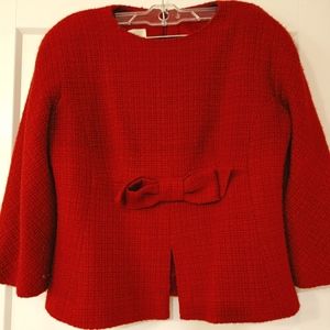 stunning woman's suit. top with bow and matching skirt